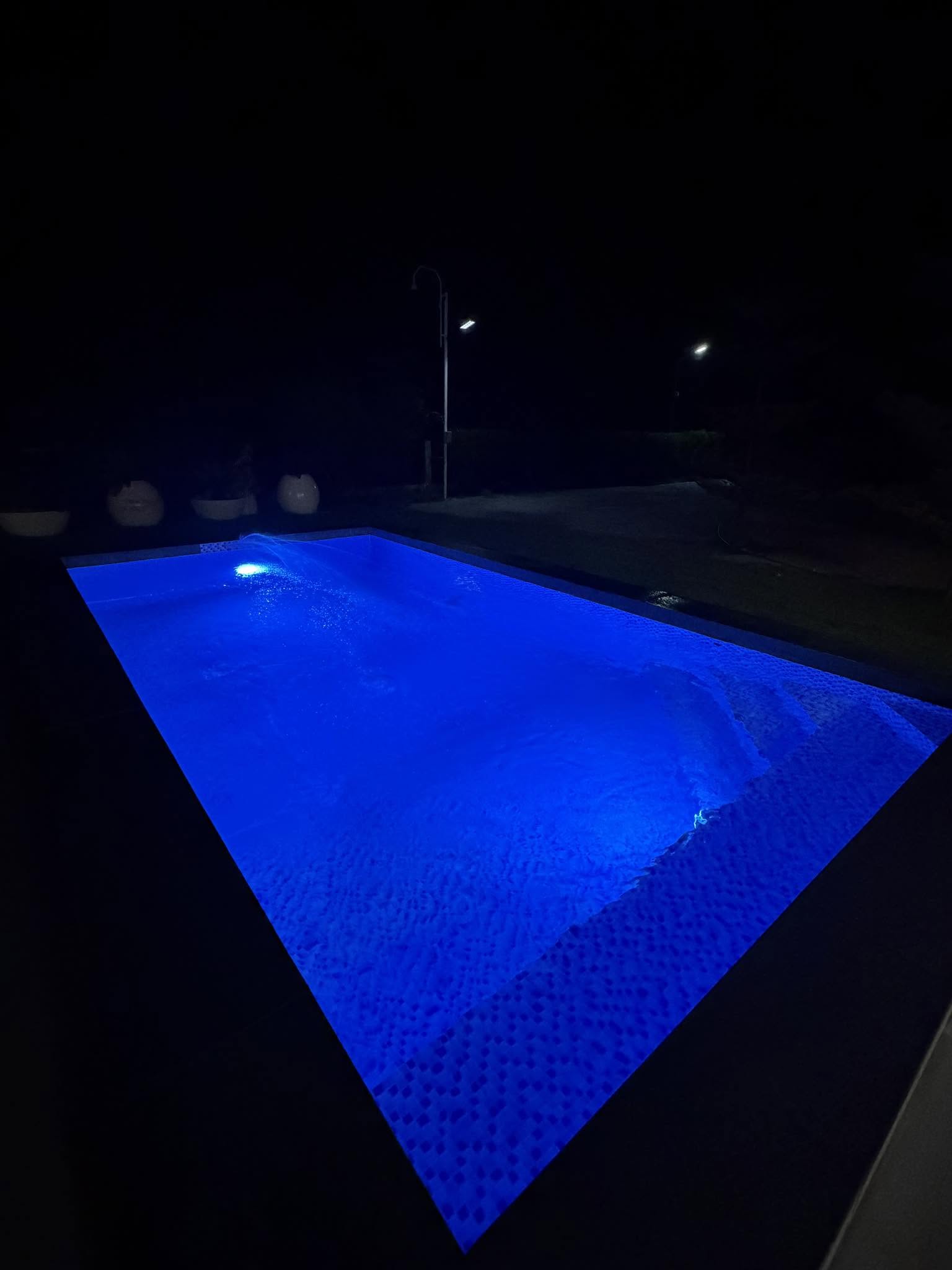 Illuminated pool at night