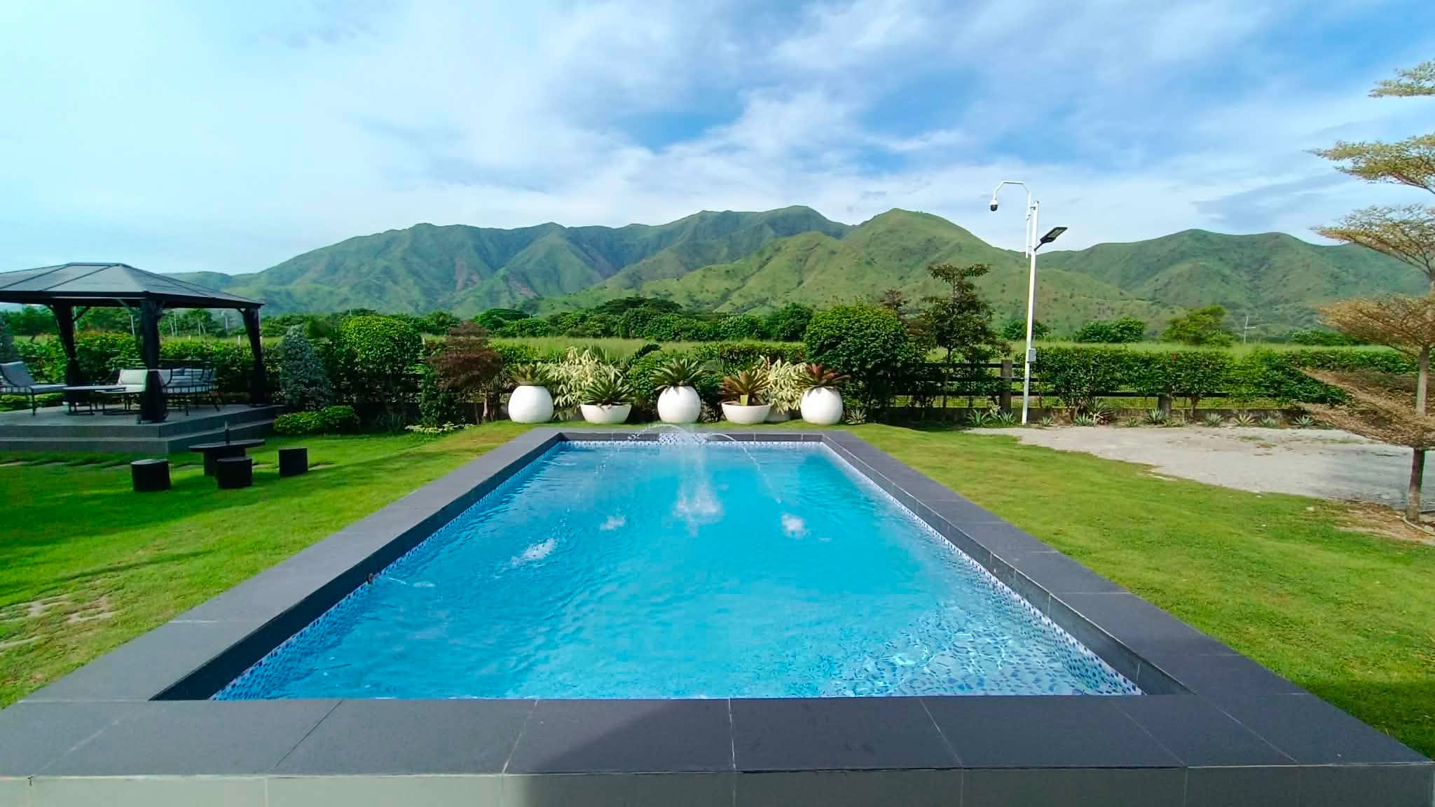 Pool, gardens, and panoramic mountain view at SanChio Rest House