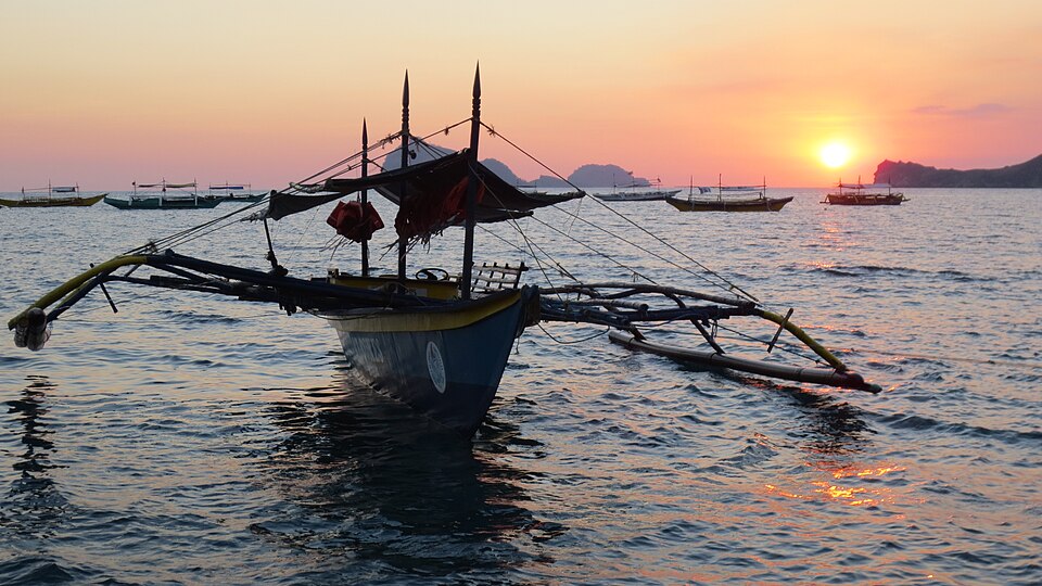 Fishing boat at sunset on Pundaquit Beach